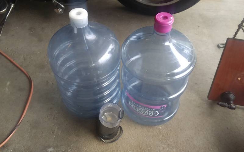 lot 12 image: 2-Plastic Water Jugs (5-Gallon), 1-Braun Grinder