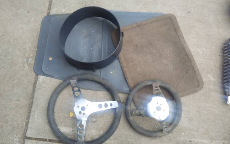 lot 27 image: 2-Steering Wheels, Floor Mats, Misc