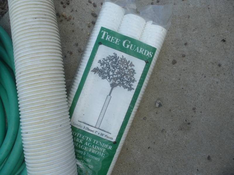 lot 16 image: Garden Hose & Tree Protectors
