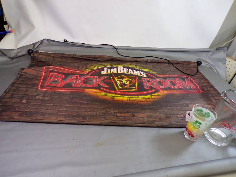 lot 36 image: Jim Beans Flag, Budweiser Pitcher, and bar Glass