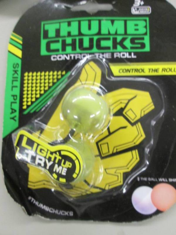 lot 60 image: 11 Thumb Chucks Stress Relievers...