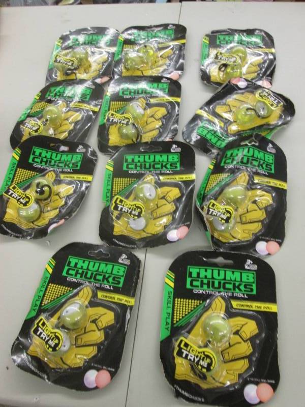 lot 61 image: 11 Thumb Chucks Stress Relievers...