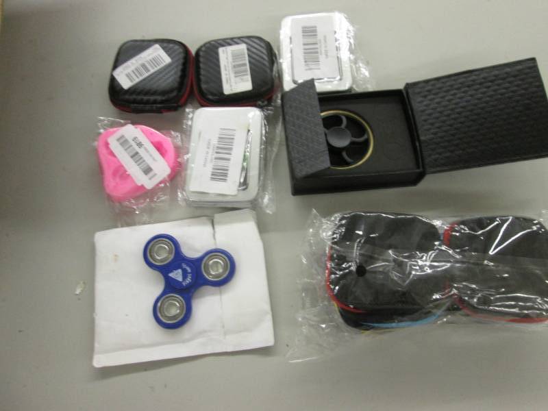 lot 70 image: Lot of 11 Fidget Spinners, Cases...