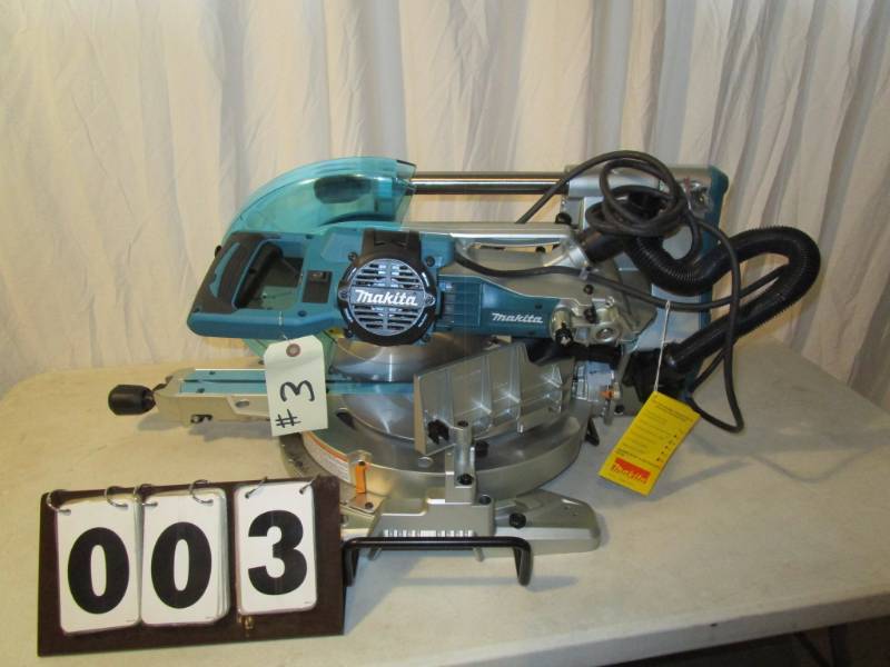 lot 3 image: Makita 12 Dual Bevel Sliding Compound Miter Saw