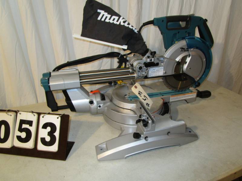 lot 53 image: Makita 10 Dual Slide Compound Miter Saw