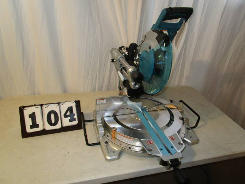 lot 104 image: Makita 10 Dual Bevel Sliding Compound Miter Saw with Laser