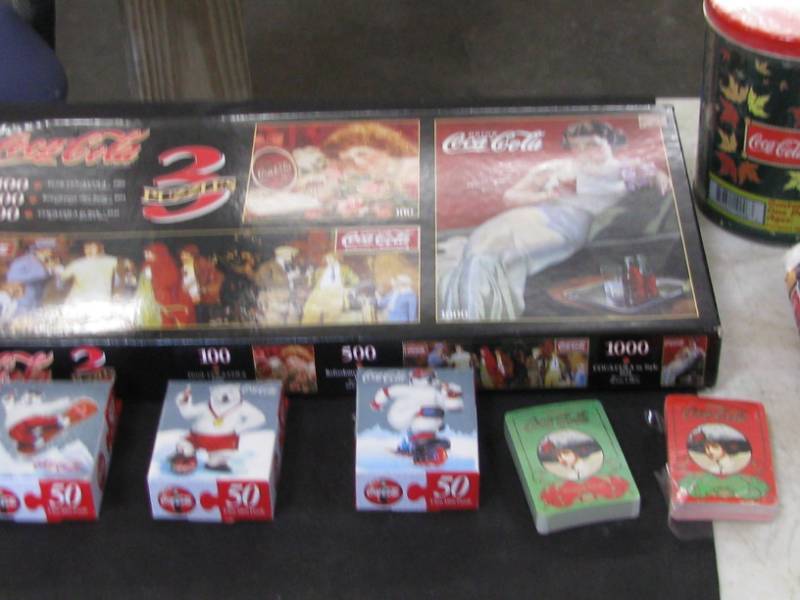 lot 31 image: Coca Cola Puzzles & Playing Cards