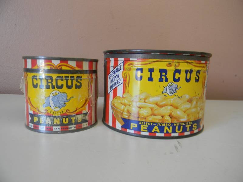 lot 18 image: 2 VINTAGE CIRCUS PEANUTS TIN CANS WITH LIDS 1 DATED 1946 TOP MARKED PREMIUM OFFER INSIDE 8OZ (IN SHRINK WRAP) & 1 DATED 19461957 13OZ Colorful very collectible cans - SEE PICTURES