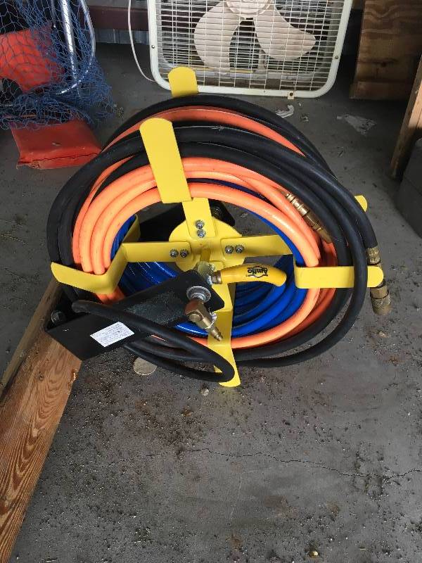 lot 94 image: Air Compressor Hose Attached to Piece Of Wood