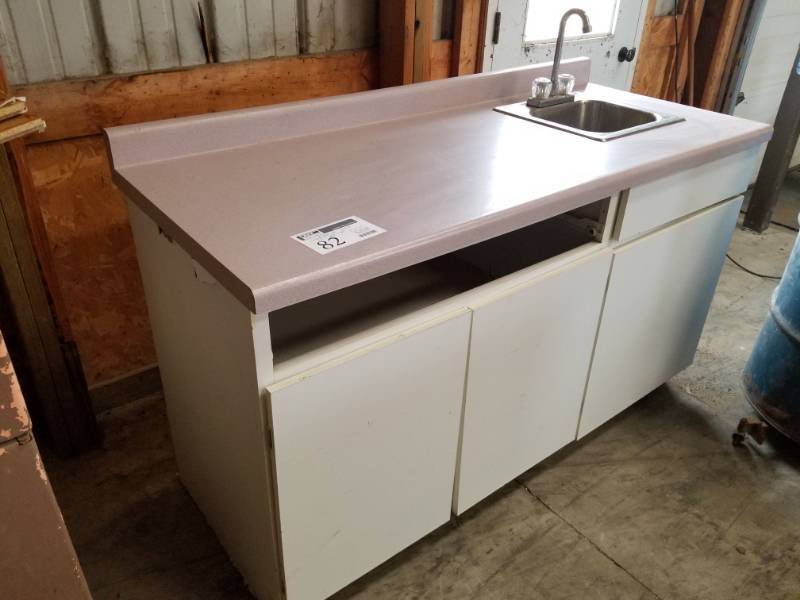 lot 82 image: Single Basin Stainless Steel and Fixtures With Wood Countertop Cabinet