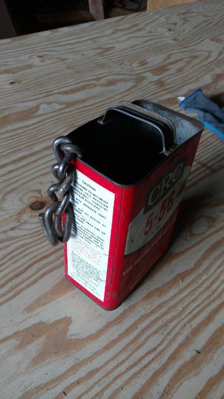 lot 37 image: CRC Metal can with tire chains inside