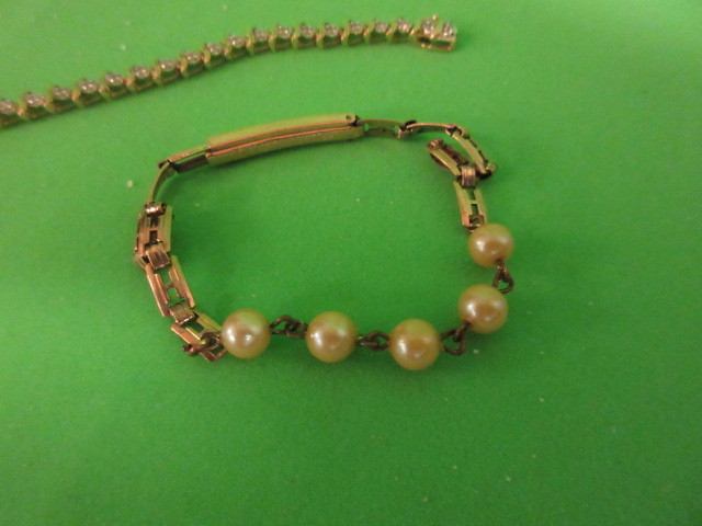 lot 305 image: 10K GOLD BRACELET AND MORE