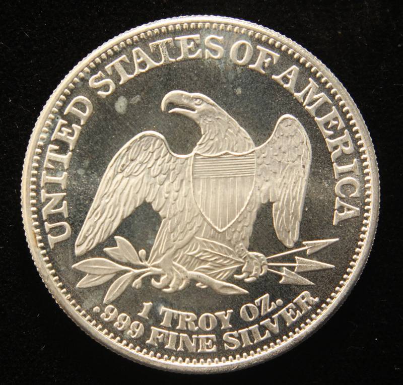 1 TROY OZ. .999 FINE SILVER SEATED DOLLAR DESIGN