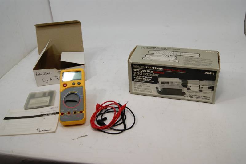 lot 11 image: Craftsman Pad Sander And Radio Shack Multi Meter