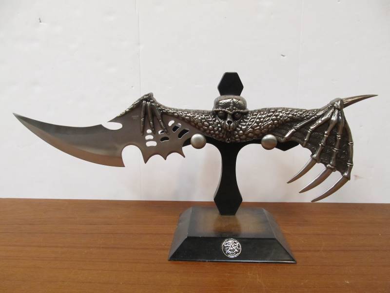 lot 27 image: Winged Skeleton Knife wStand