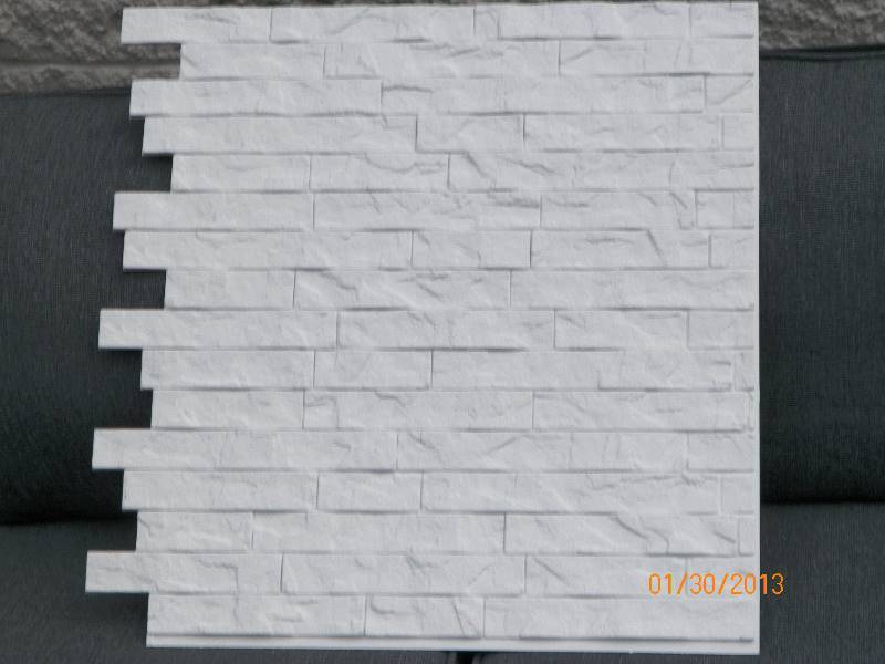 lot 100 image: Innovera Dcor by Palram - 24 x 24 Ledge Stone Decorative Vinyl Wall Paneling in White (9-Pieces) - 1 CASE