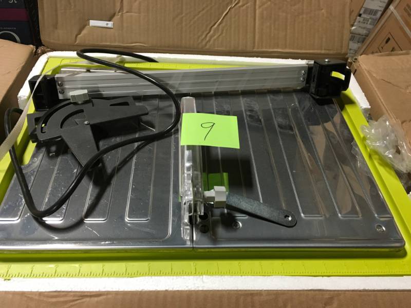 lot 9 image: RYOBI 7 in. 4.8 Amp Tabletop Tile Saw in good condition