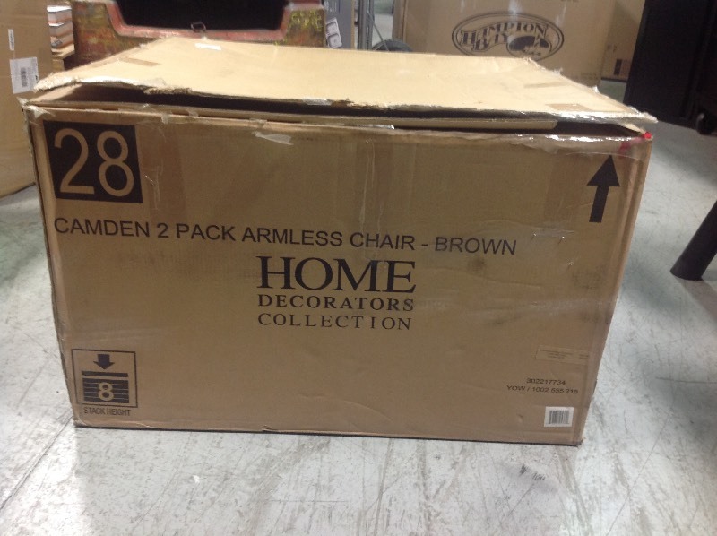 lot 116 image: Home Decorators Camden Dark Brown Wicker Outdoor Armless Dining Chair with Sunbrella Fretwork Flax Cushion (2-Pack) not used