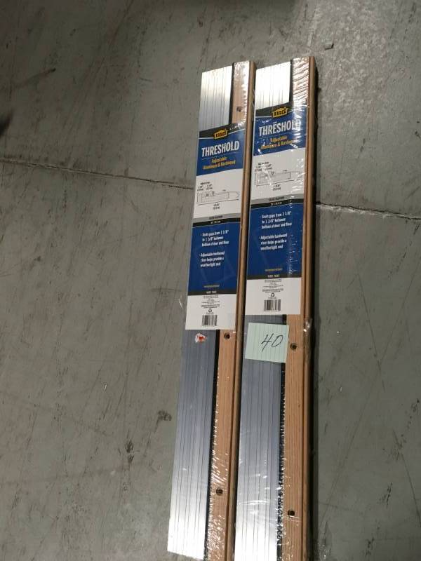 M-D Building Products 4-916 in. x 36 in. Satin Aluminum and Oak Adjustable Threshold in good condition