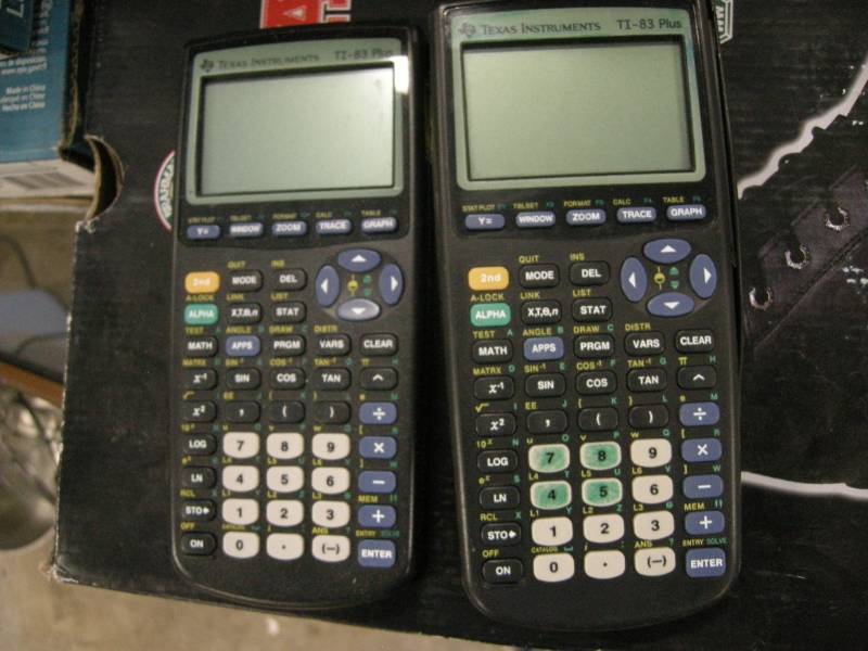 lot 199 image: 2 Texas Instrument Ti-83 Plus Calculators