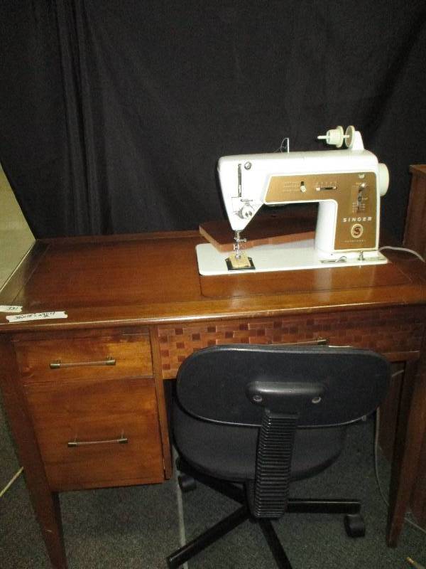 singer sewing machine in cabinet