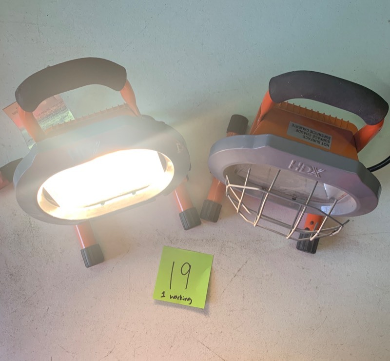 lot 19 image: HDX Work Lights one works- missing Shield, Other one is SALVAGE for parts