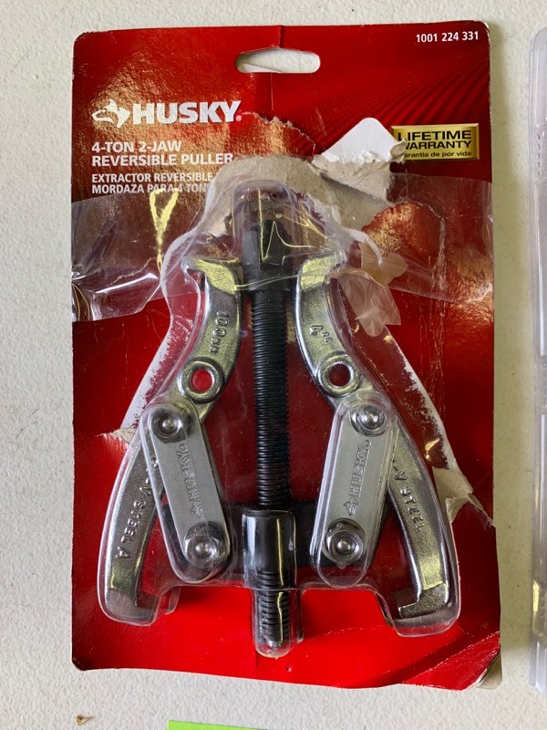lot 58 image: Hand tool lot- Husky 2- Jaw reversible puller, Buck Bros. Wood chisel, ac pro charging hose, zircon Studsensor