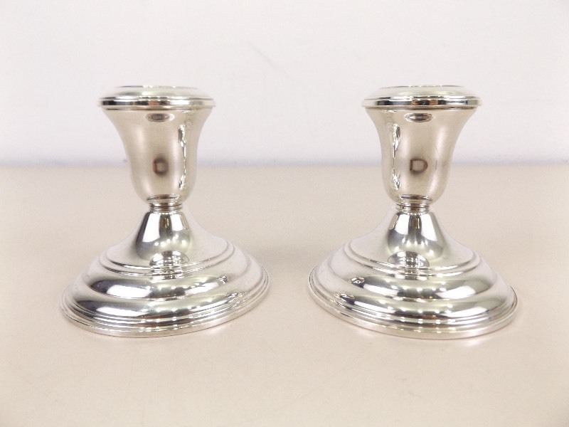 lot 70 image: 2 Reed and Barton Sterling Silver Weighted Candle Holders