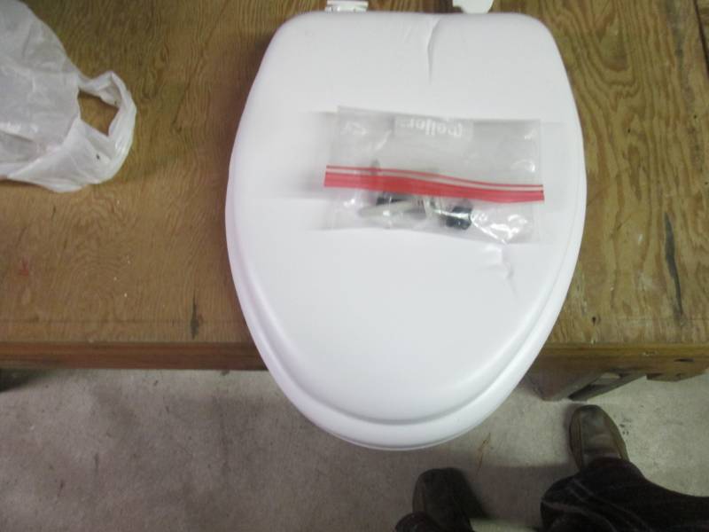 padded toilet seat open package...