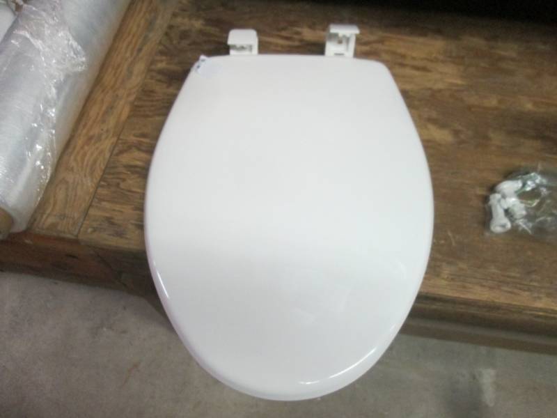 elongated toilet seat open package...