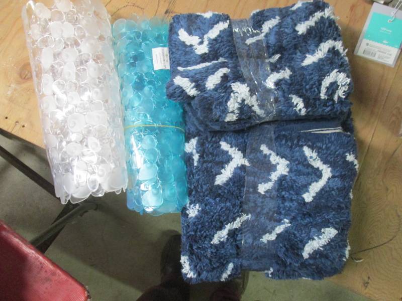 lot of bath and tub mats ...