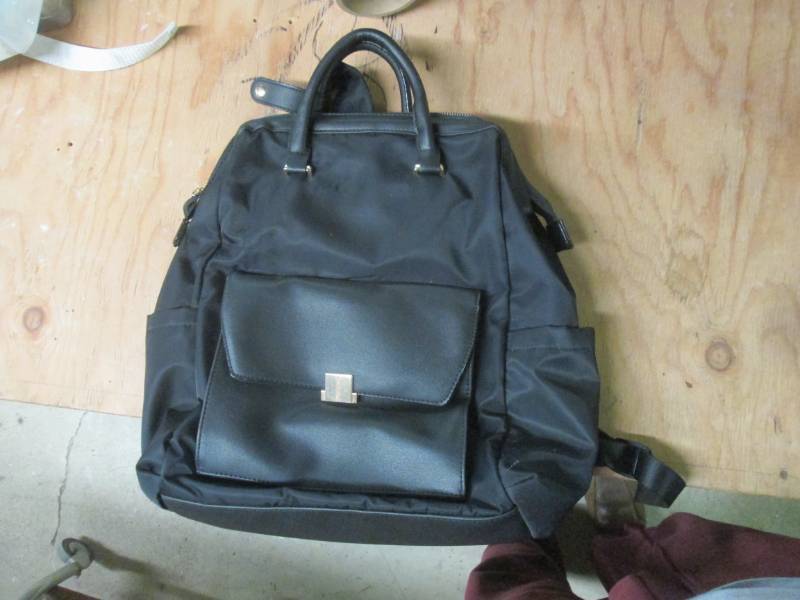 black purse handbag bag pack...