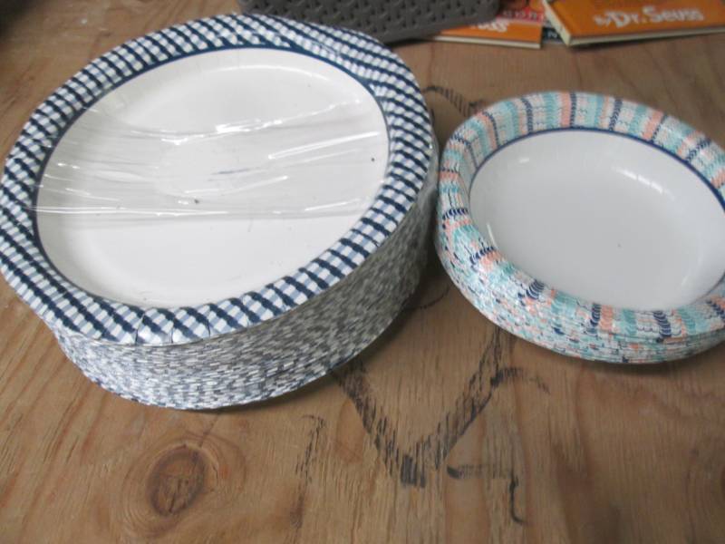lot of paper plates some damaged...