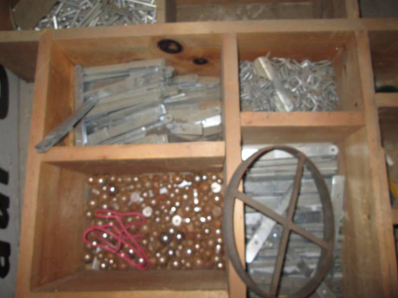 2 organizers of ball bearings, bolts and other hardware on caster wheels