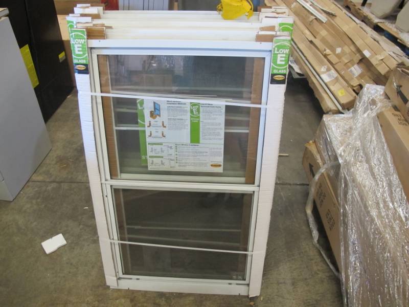 lot 20 image: Pair of LARSON 24 in. x 39 in. 2-Track Double Hung Storm Aluminum Window