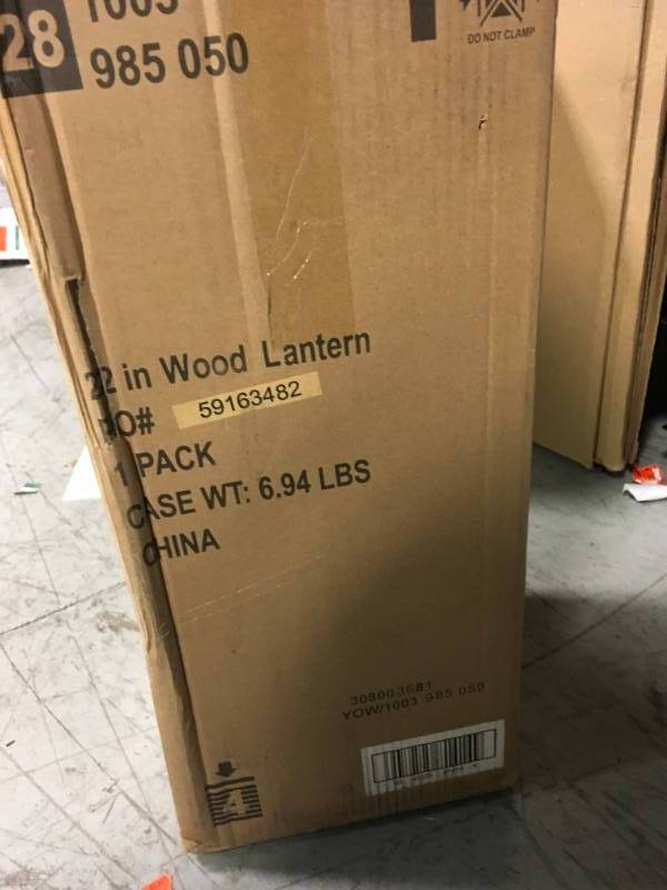 lot 85 image: Hampton Bay 22 in. Rustic Wood Lantern with Metal Top in good condition