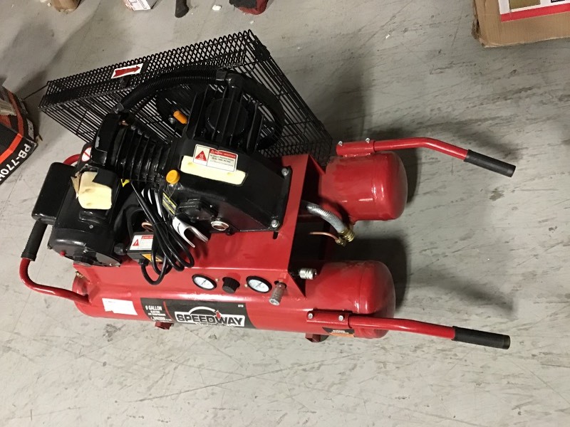 lot 106 image: SPEEDWAY 9 Gal. 2 HP Wheelbarrow Design Electric Air Compressor with Run-Flat Tire IN like new conditions have small damage and missing filter cap