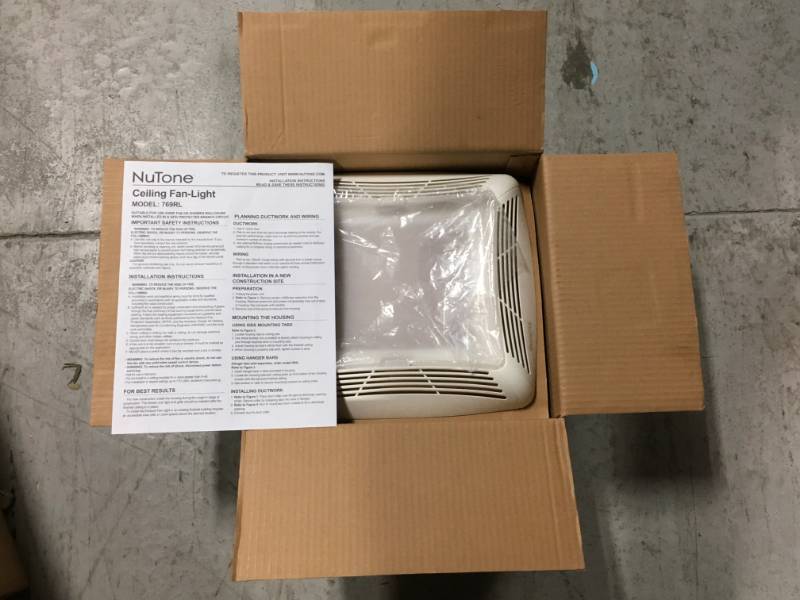 lot 30 image: NuTone 70 CFM Ceiling Bathroom Exhaust Fan with Light, White Grille and Light not used