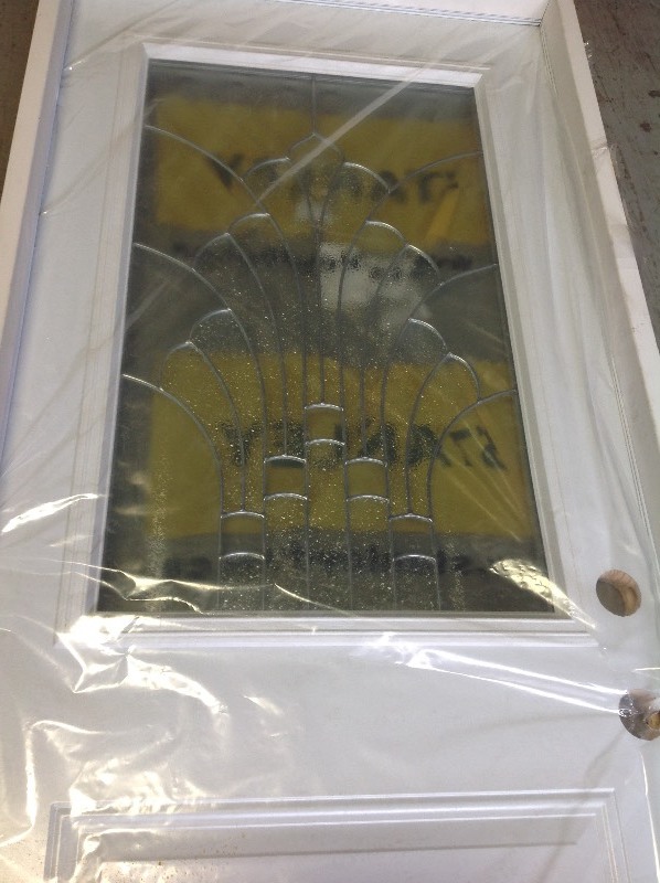lot 113 image: Stanley Doors 37.375 in. x 83 in.  Left-Hand Half whit glass not used retail $ 700