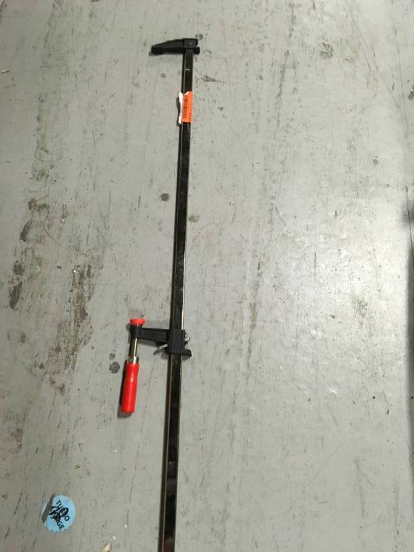 lot 25 image: BESSEY 36 in. Clutch Style Bar Clamp with Wood Handle and 2-12 in. Throat Depth in good conditions