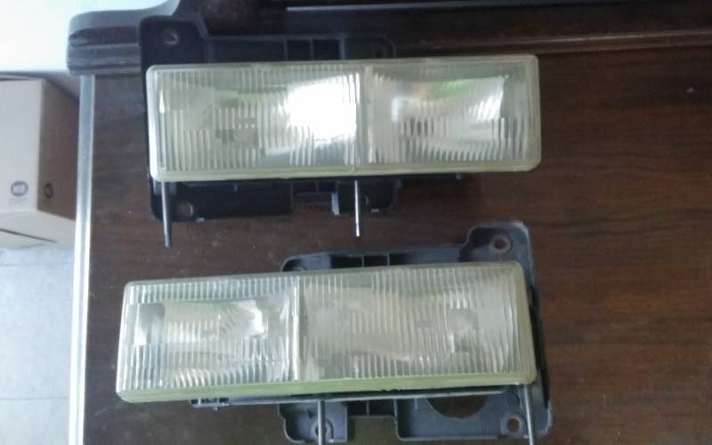 lot 26 image: Pair Head Lamps 1990-1998 Chev Pick-UP SuburbanTahoe, Also Marker Lights & Speedo Cluster.