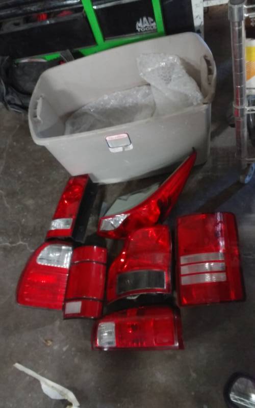 lot 31 image: 7 Assorted Taillights OEM New