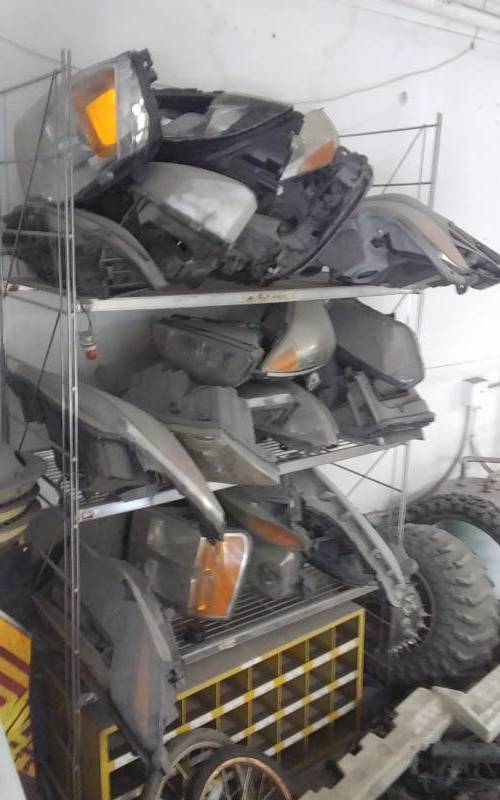 lot 42 image: 30 Assorted Head Lamp Capsules Assys, Includes Shelving Rack