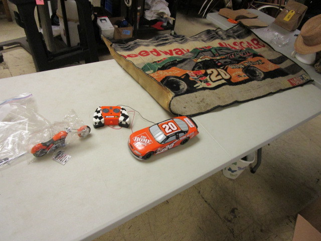lot 426 image: TONY STEWART RC CAR, COLLECTOR MOTORCYCLE AND DOOR MAT
