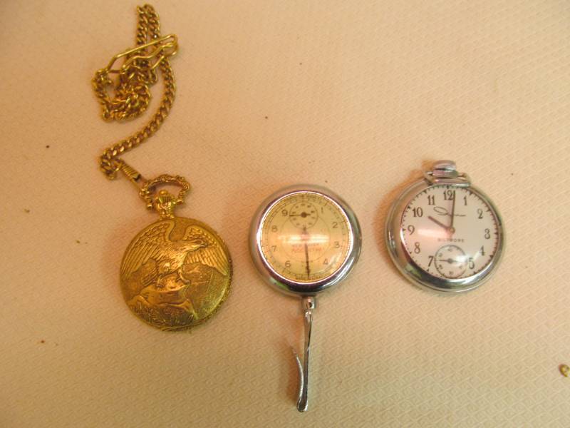 lot 53 image: pocket watches, pedometer