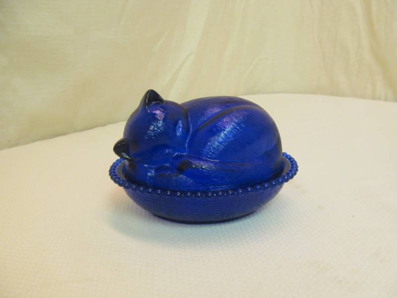 lot 102 image: cobalt blue cat in dish