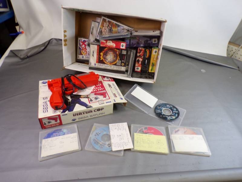 lot 22 image: Saga Arcade Gun and 6 Saga Games and Saga Game Cases