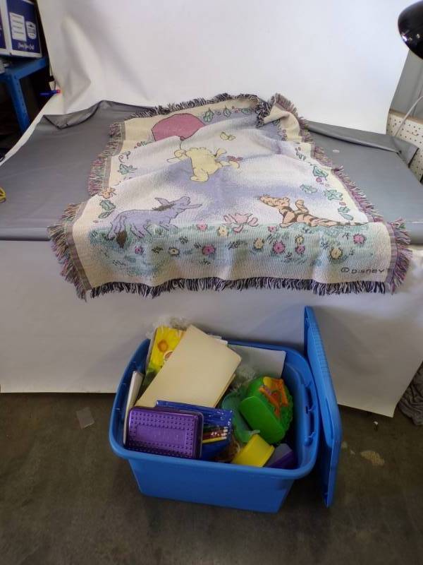 lot 41 image: Whinnie the Pooh Rug and Tote with Toys and books