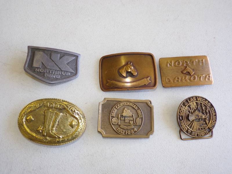 lot 55 image: North Dakota Brass Belt Buckles
