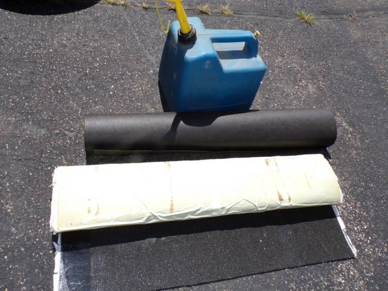 lot 57 image: 5 Gallon Can with 34 Full Diesel and 2 Rolls Roof material